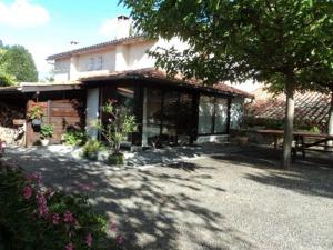 a house with a bench in front of it at Le Moulin in Sauzet