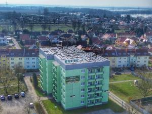 an aerial view of a building in a city at Alpha Apparthotel leipzig-Rötha in Rötha