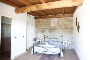 Postel nebo postele na pokoji v ubytování Il Borgo Ariccia Resort