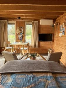 a living room with a table and chairs at B&B Bed in Burgh in Burgh Haamstede