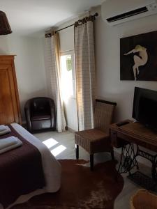 Postel nebo postele na pokoji v ubytování Hôtel Restaurant Le Provençal