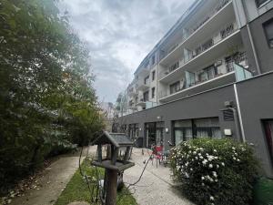 a building with a sign in front of it at Appart One Chambéry in Chambéry
