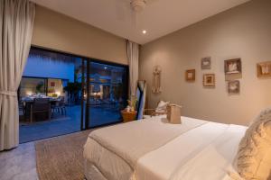 a bedroom with a bed and a dining room at VILLA LOUMA - 4 Bedrooms with Private Pool in Koh Samui +106 photos