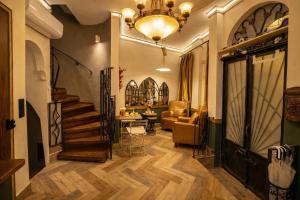 a hallway with a staircase and a living room at The House Company in Istanbul