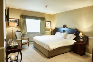 Ένα ή περισσότερα κρεβάτια σε δωμάτιο στο The Golden Pheasant