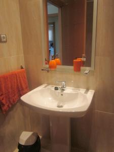 a bathroom with a white sink and a mirror at 2108-Nice apt with pool close from beach and bars in Manilva