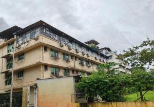 a building with a sign on the side of it at Hotel The Star in Kālundri
