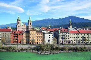 a city with buildings and a body of water at Apartment Mischa in Innsbruck