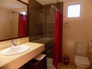 a bathroom with a sink and a shower and a toilet at Casa Jazmin in Cala Bona +25 photos