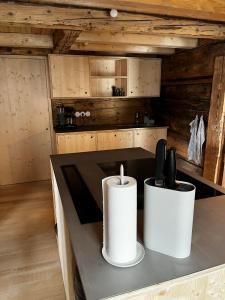 a kitchen with a counter with two candles on it at Hirschberg 231 in Bizau
