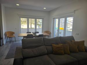 a living room with a couch and a table at Casa Sol em Castelo Branco in Castelo Branco