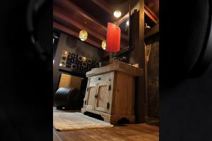 a room with a wooden cabinet and a red light at Domaine 10 in Schore +42 photos