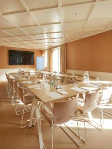 a large conference room with a large table and chairs at Hotel de Silhouette in Biarritz
