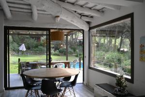 a dining room with a wooden table and chairs at Homenfun Costa Brava Begur Villa in Begur