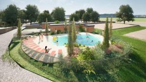 an overhead view of a swimming pool with people in it at Camping Canal de Berry in Saint-Amand-Montrond
