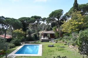 a house with a swimming pool in a yard at Homenfun Costa Brava Begur Villa in Begur