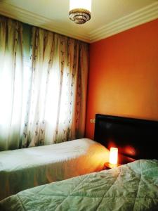 Katil atau katil-katil dalam bilik di Perle de Tamaris