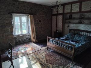 a bedroom with a bed and a window at Face à la Mer in Perros-Guirec