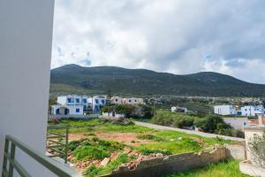 a view from the balcony of a house with mountains in the background at Villa Selina 3 - Etheras Properties in Kythira