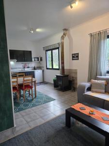 a living room with a couch and a table at Quinta Velha in Ribeira Grande