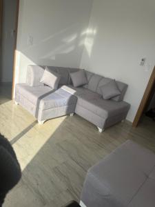 a living room with a couch and a table at La chebba plage in Chebba +1 photo