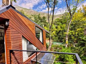 a house with a view of the mountains at ZenCapeTown Forest Retreat in Cape Town
