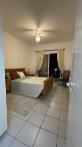 a bedroom with a large bed and a window at Luxury 3Bedroom Villa with Pool, Garden & Sunset in Tala