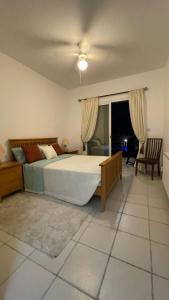 a bedroom with a large bed in a room at Luxury 3Bedroom Villa with Pool, Garden & Sunset in Tala