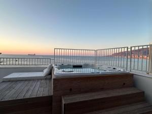 a hot tub on a balcony with a view of the ocean at Cielomare Residence Diffuso in Trapani +95 photos
