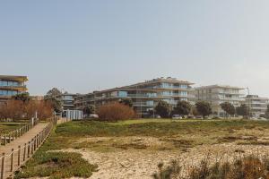 a view of a building from the beach at Luxury Beach House by Hosty in Canidelo