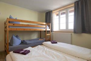 a bedroom with two bunk beds and a window at Hochwaldbaude in Hain
