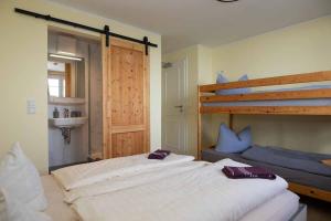 a bedroom with two beds and a bunk bed at Hochwaldbaude in Hain +27 photos