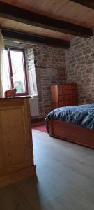 a bedroom with a bed and a window in a room at Chambre double chez Emilienne in Téterchen +8 photos