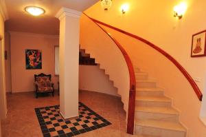 a hallway with a spiral staircase in a house at ALANYA KONAKLİ APART in Alanya