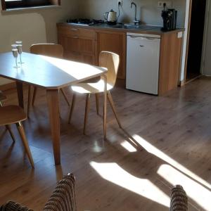 a kitchen with a table and chairs and a table and a table and a kitchen at Klik Klak Studio in Bornem +11 photos