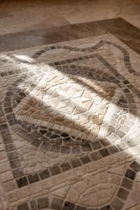 a mosaic floor with a depiction of a peacock at Casa de Eli - Tenuta Torre Zecchei Wine Experience in Valdobbiadene +51 photos