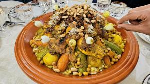 a plate of food with nuts on a table at Tizi Maison d'Hôtes in Telouet