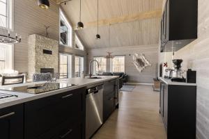 a kitchen with a sink and a counter top at Röningen 24 - Bruksvallarna in Bruksvallarna +21 photos