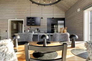 a kitchen and dining room with a table and chairs at Röningen 24 - Bruksvallarna in Bruksvallarna