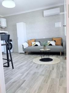 a living room with a couch and a table at Apartamento en Lorca Murcia in Lorca