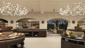 a large kitchen with aasteryasteryasteryasteryasteryasteryasteryasteryasteryasteryastery at THE NEW RONACHER Thermal Spa Hotel in Bad Kleinkirchheim