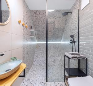 a bathroom with a shower and a sink and a tub at Cabin Balaton in Vonyarcvashegy +55 photos
