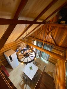 an overhead view of a dining room with a chandelier at Cabana Do Lago in Joinville +7 photos