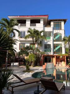 a building with a swimming pool in front of a building at Casa Mezcaleria formerly Boracay Beach Club in Boracay