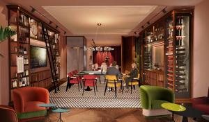 a restaurant with a table and chairs in a room at Urban Hive Paris in Paris