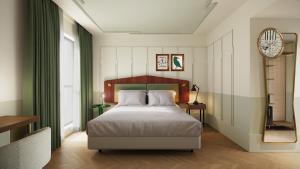a bedroom with a bed and a large window at Urban Hive Paris in Paris