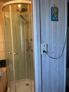a shower in a bathroom with a glass shower backdoor at Beau-sejour in Francorchamps +16 photos