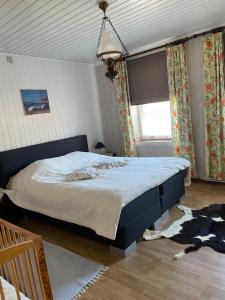 a bedroom with a large bed and a window at Beau-sejour in Francorchamps