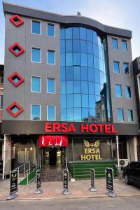 a hotel building with a sign in front of it at ERSA Hotel in Tuzla
