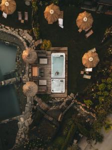 an overhead view of a building with umbrellas at Jufenalm BOHO & Wellnesshotel in Maria Alm am Steinernen Meer